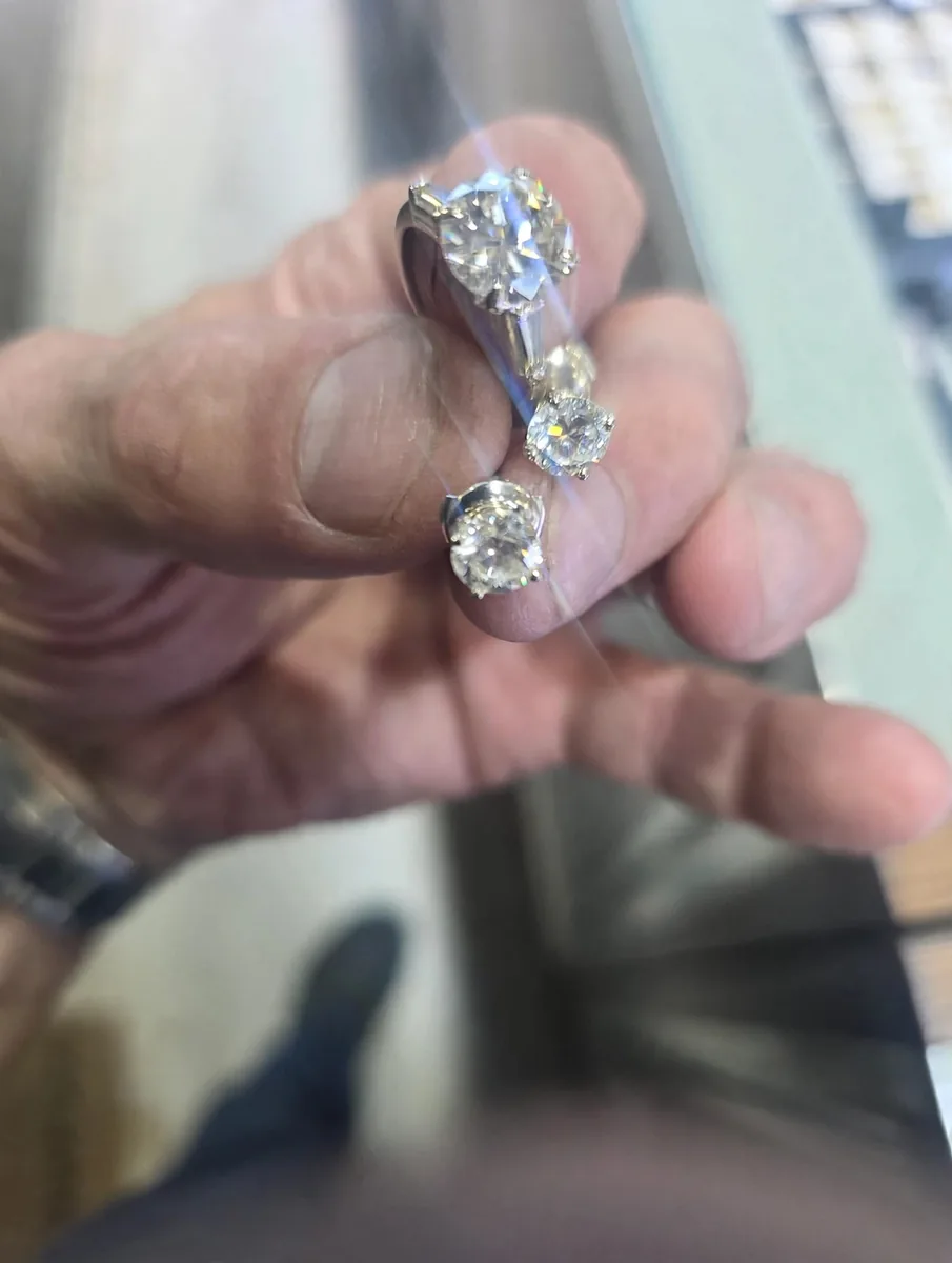 Diamond solitaire ring with matching earrings