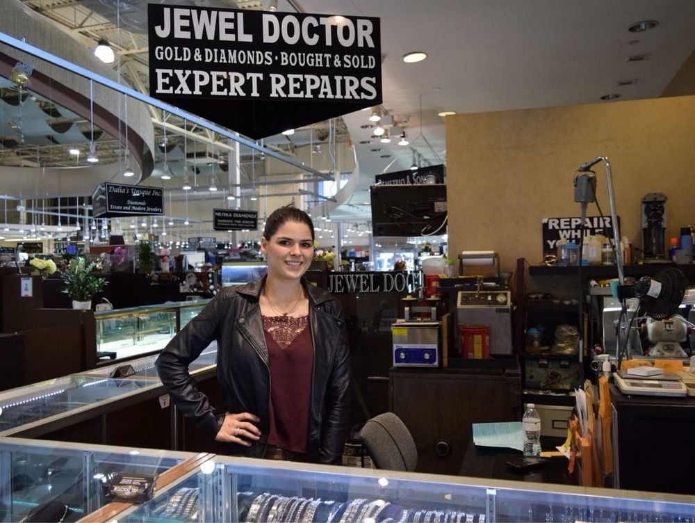 Welcoming customers inside The Jewel Doctor at Booth 36