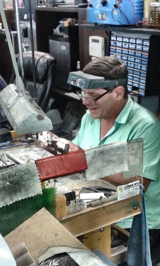 Paul working on jewelry at his workbench